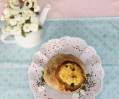 Bacalhau no pão com espinafres e azeitonas